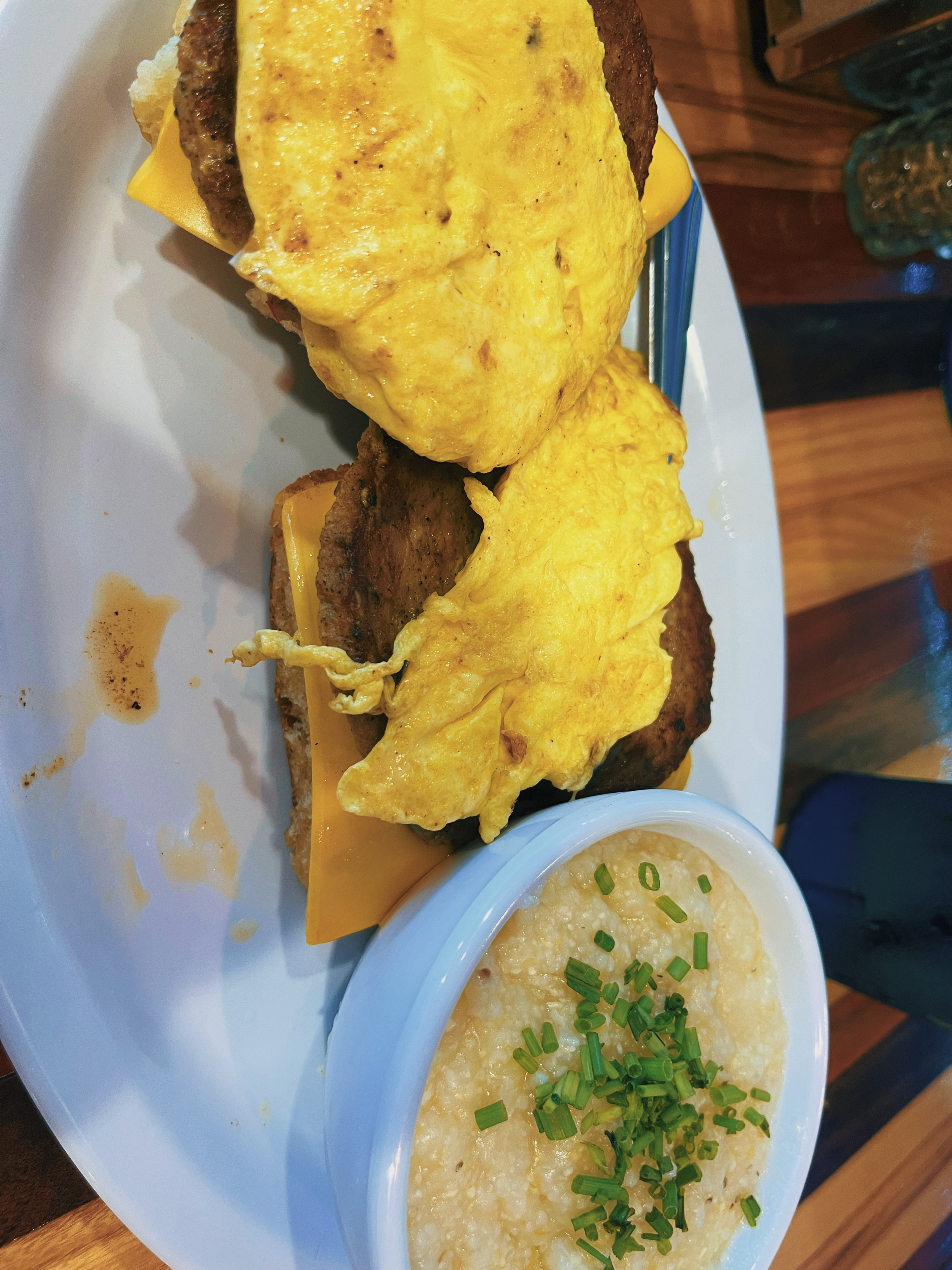 sausage egg and cheese biscuit with a side of grits 
