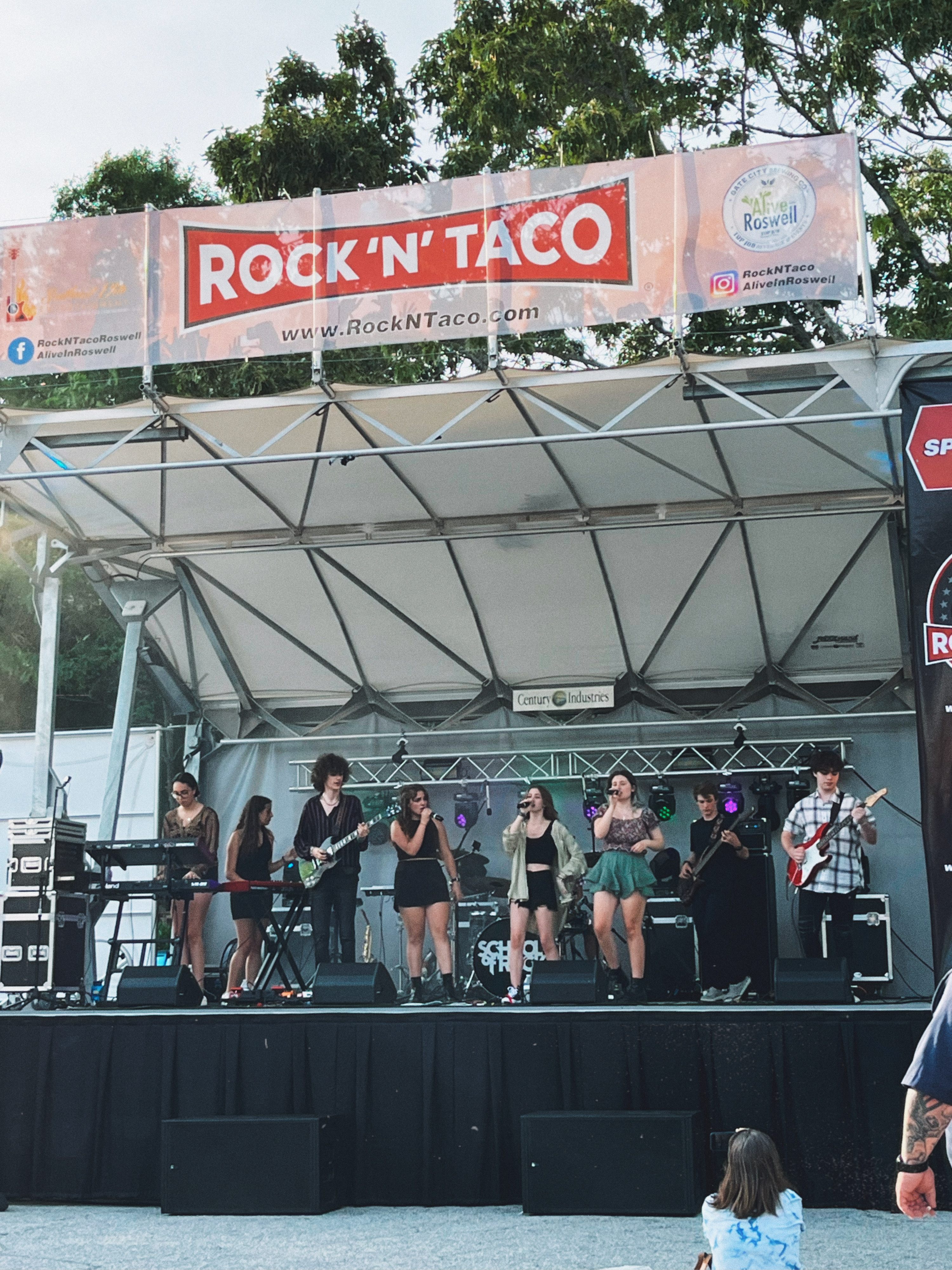 stage with a local band performing at Alive After 5 in Roswell, Georgia
