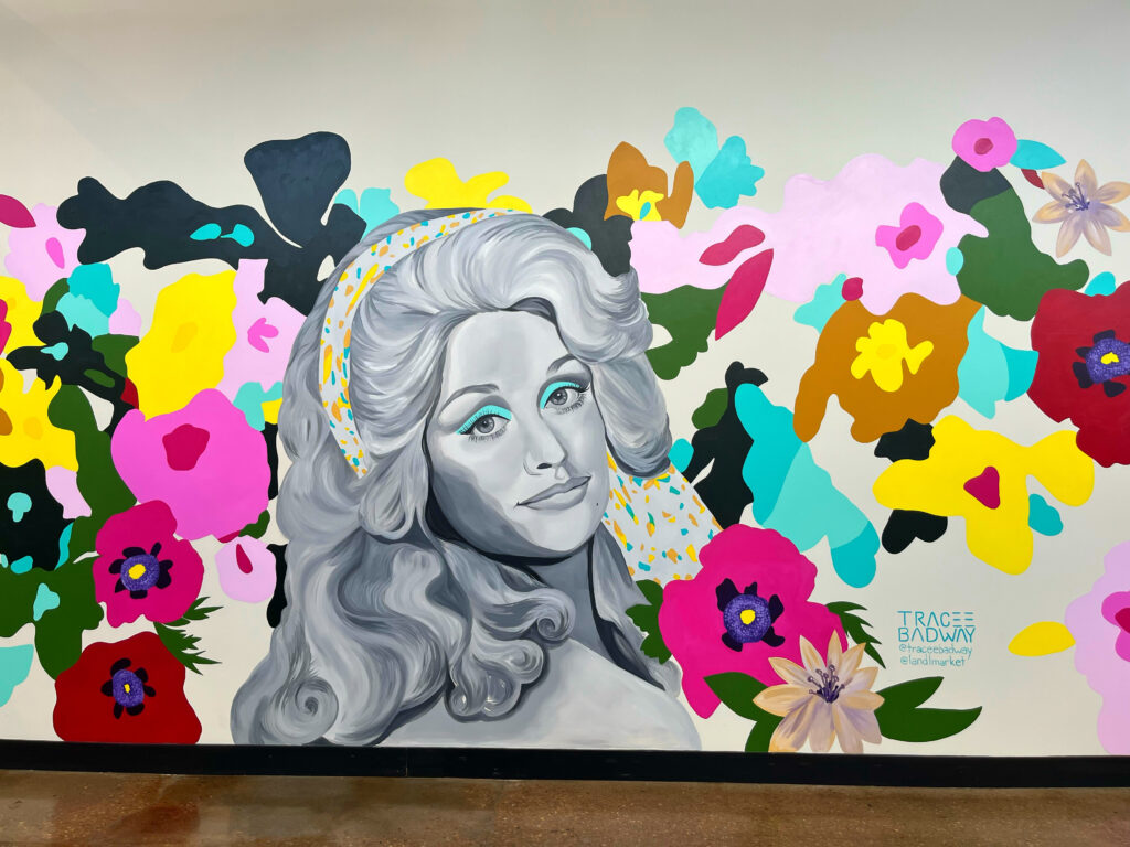 colorful, floral, Dolly Parton mural found at the L&L Market in Nashville