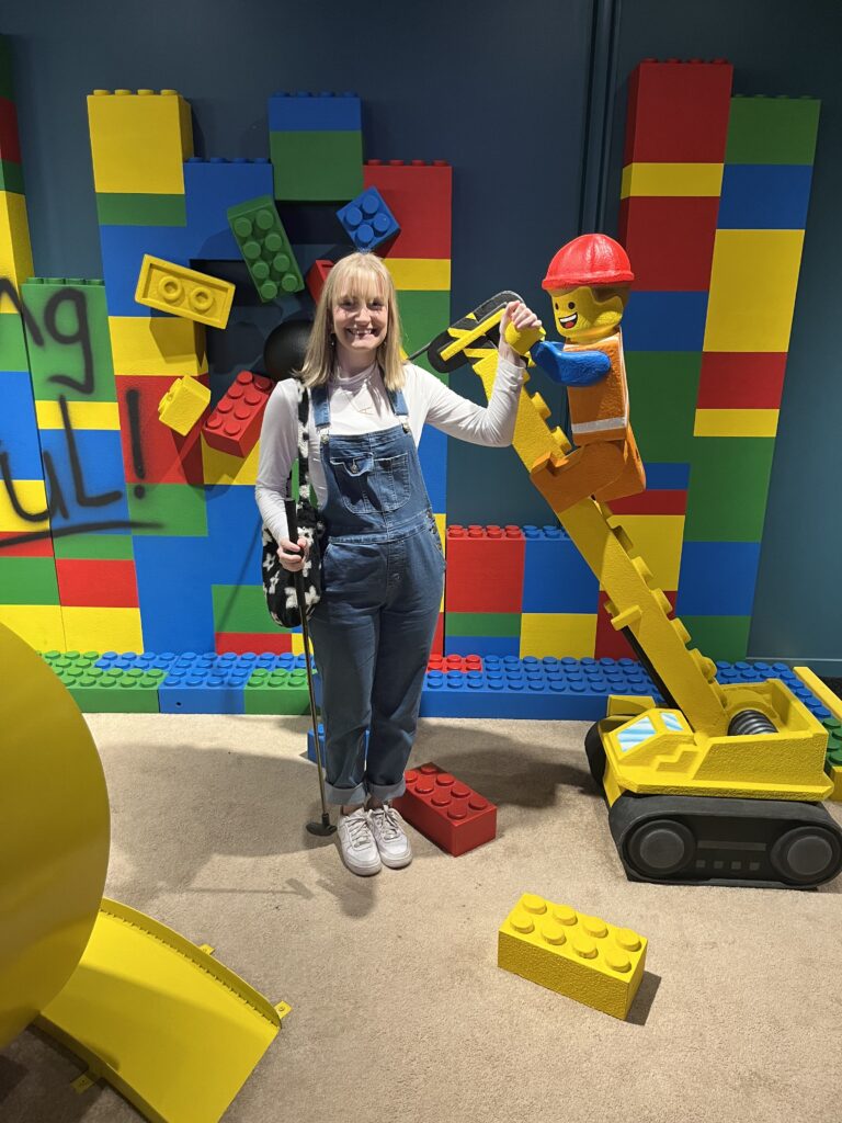 Me standing on The Lego Movie Mini Golf Course at Group Therapy: Pub and Playground