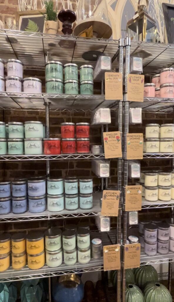 Lots of colorful candles inside GVL Soy Candle Co 