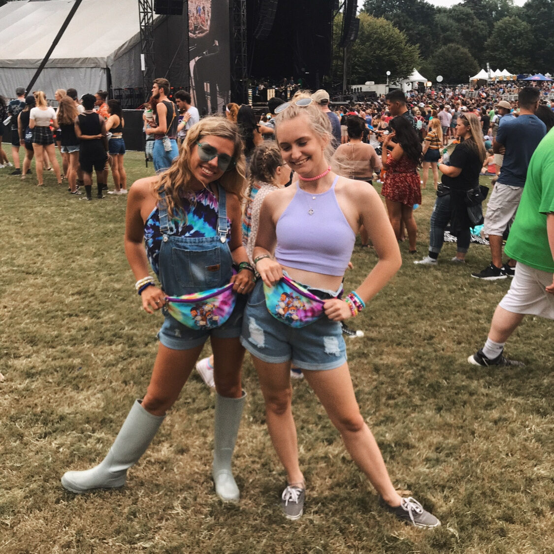 two girls at Music Midtown showing off their Rugrats fanny packs