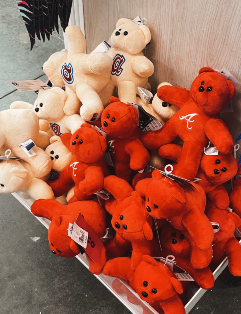 2 different options of Atlanta Braves teddy bears found at Threads, one is tan and one is red. 