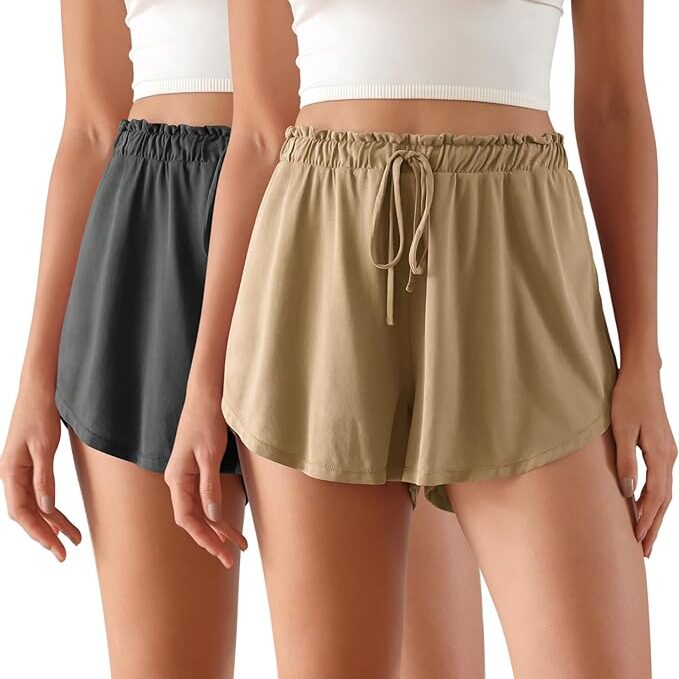 Two pairs of cute drawstring athletic shorts. One pair is black and one is tan