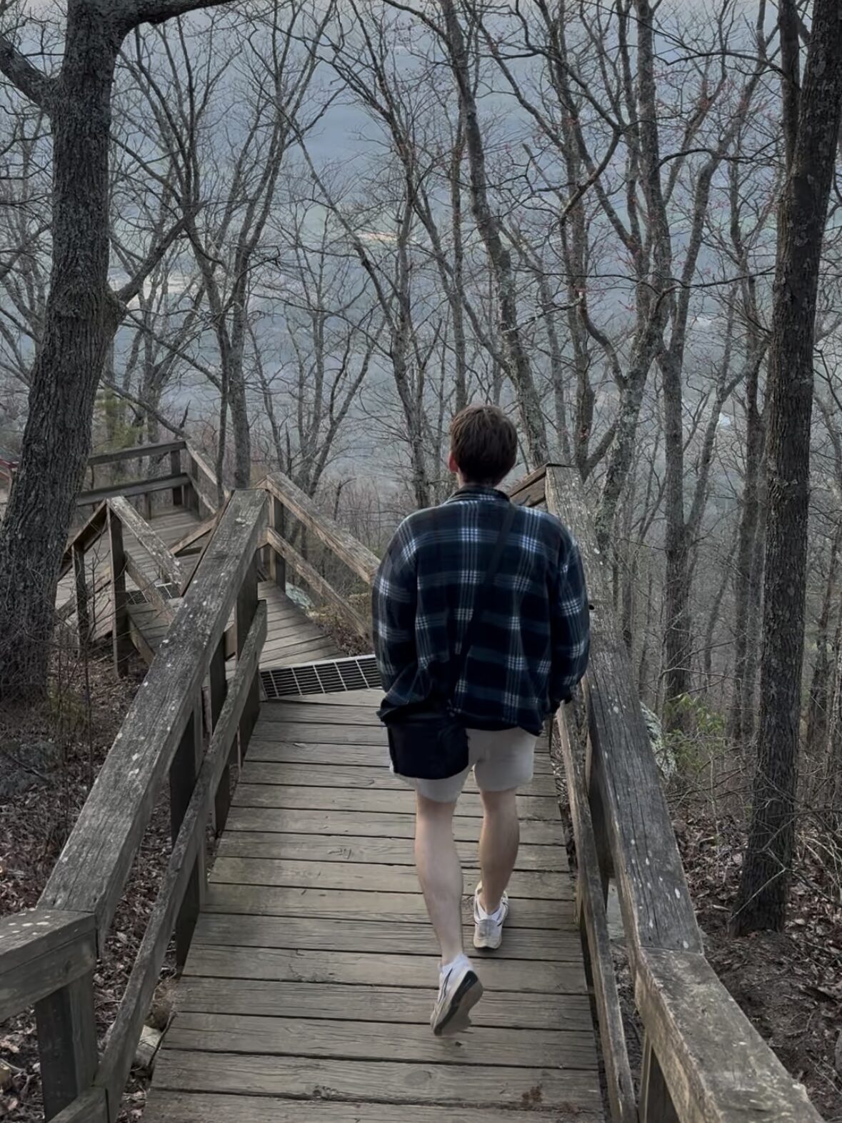 man walking down the steps to the Fort Mountain West Overlook